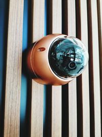 High angle view of camera on wood