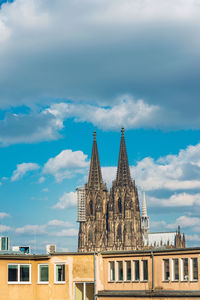 Low angle view of buildings in city against sky