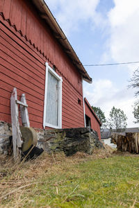 Abandoned house on field against sky