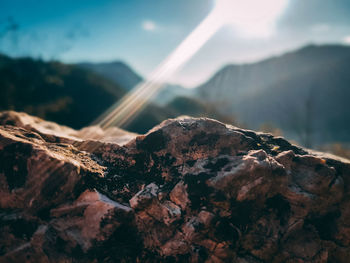 Close-up of rock against sky