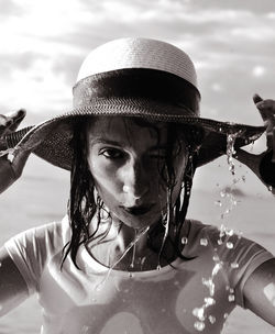 Portrait of young woman in hat