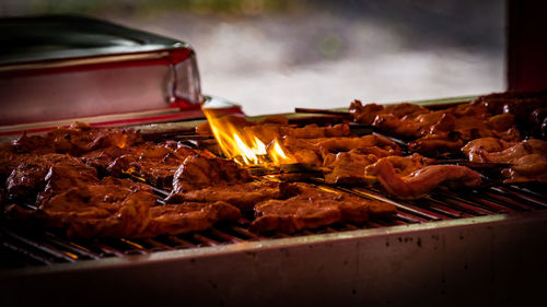 Meat cooking on barbecue grill