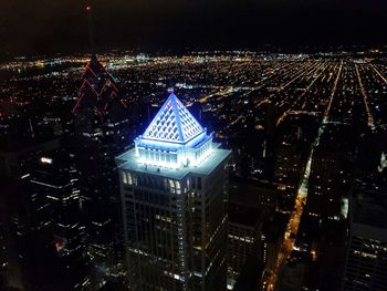 High angle view of illuminated buildings in city at night