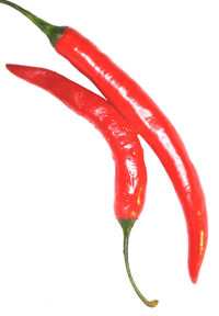 Close-up of red object over white background