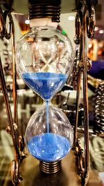 Close-up of clock on sand