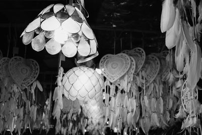 Close-up of illuminated lanterns for sale in market