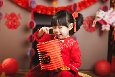 Cute girl standing in traditional clothing