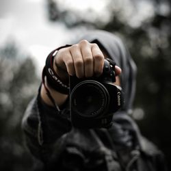 Portrait of man photographing camera