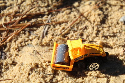 Close-up of toy car on sand