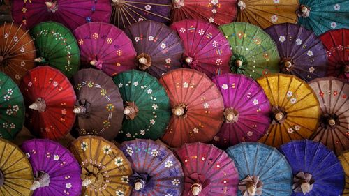 Full frame shot of multi colored umbrellas in market