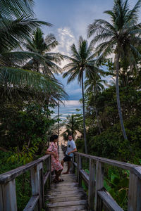 People walking on footbridge