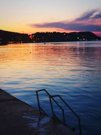 Scenic view of sea against sky at sunset