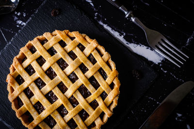 High angle view of bread on metal grate