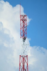 Low angle view of communication tower against sky