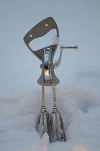 Low angle view of mixer in snow