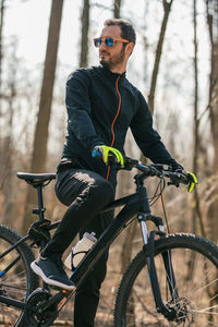 Portrait of young cyclist resting