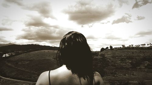 Rear view of woman against sky