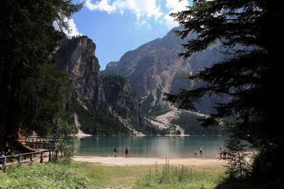 Scenic view of lake and mountains against sky