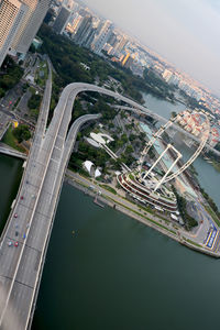 High angle view of modern buildings by road in city