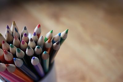 Close-up of colored pencils on table