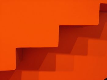 Close-up of illuminated orange wall