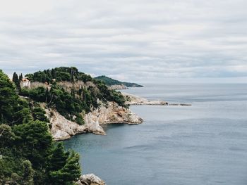 Scenic view of bay against sky