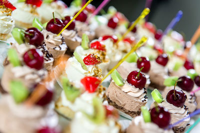 Close-up of small decorated cakes on table