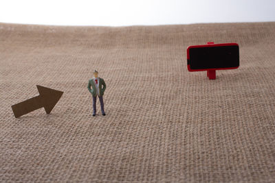 Close-up of figurines on burlap