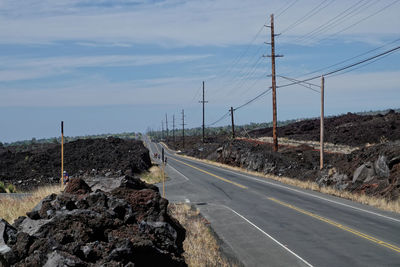 Empty road against sky - volcanic landscape