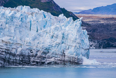 Scenic view of frozen sea against mountain