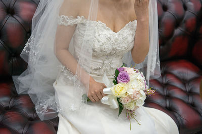 Close-up of woman holding bouquet