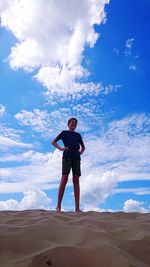 Full length of man standing on land against sky
