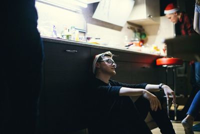 Man with eyes closed sitting at home