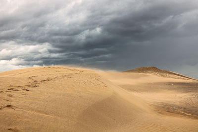 Scenic view of desert against the sky.