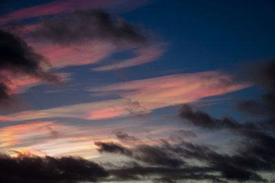 Low angle view of clouds in sky during sunset