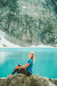 Man sitting on rock