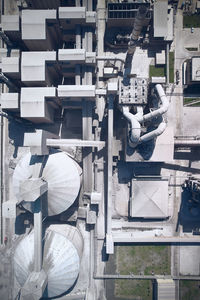 Structures of cement producing plant. top down aerial view of huge industrial factory