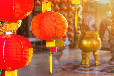 Illuminated lanterns hanging outside building