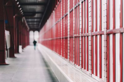 Rear view of man walking in corridor