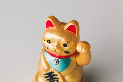Close-up of toy figurine against white background