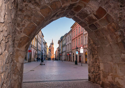 View of alley amidst buildings in town
