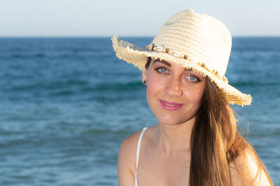Portrait of smiling young woman in sea