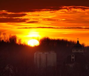 Scenic view of silhouette landscape against romantic sky at sunset