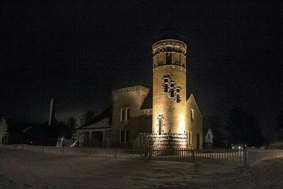 Low angle view of built structure at night