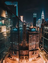 Aerial view of illuminated cityscape at night