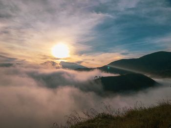 Scenic view of mountains against sky during sunset