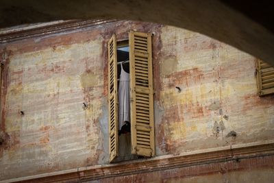 Low angle view of window on old building