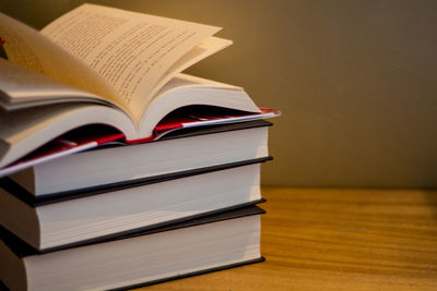 Close-up of books on wooden table