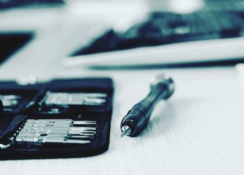 Close-up of work tool on table