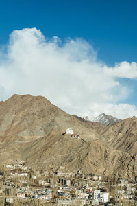 Beautiful landscape of mountains with sun over them in ladakh. captured during snowfall.